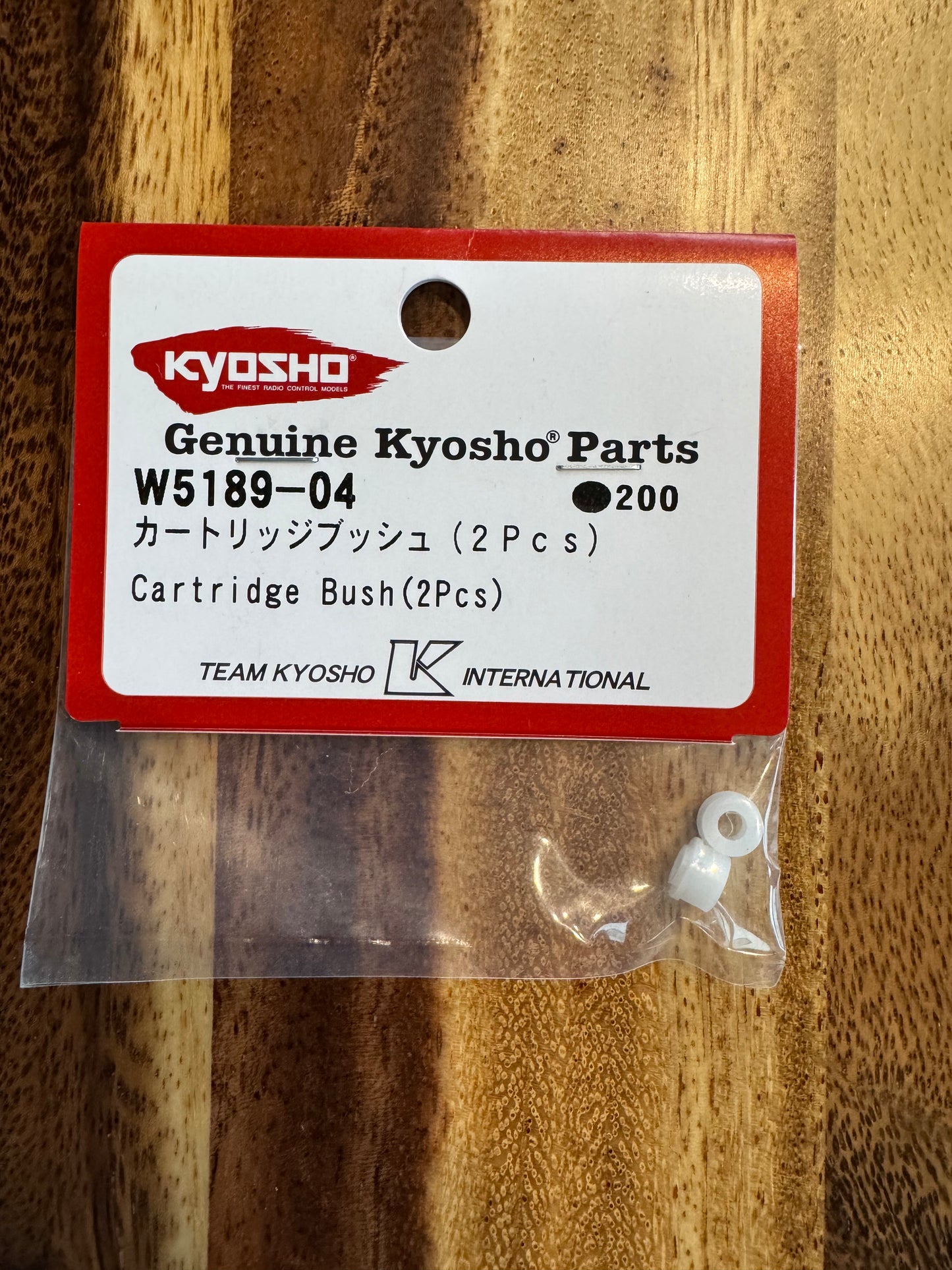 Extended travel cartridge bushing